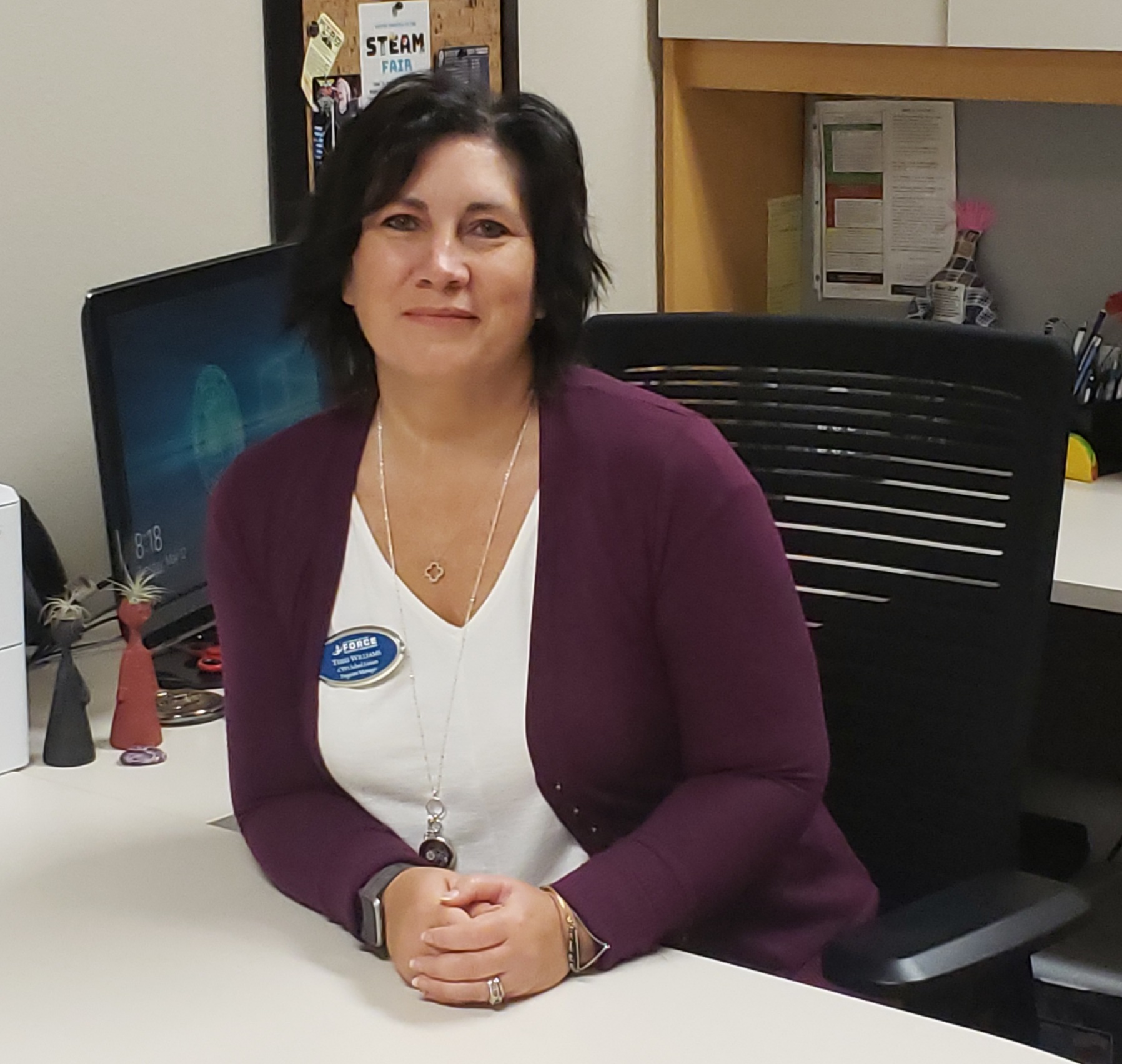 Picture of woman sitting at desk Picture of woman sitting at desk